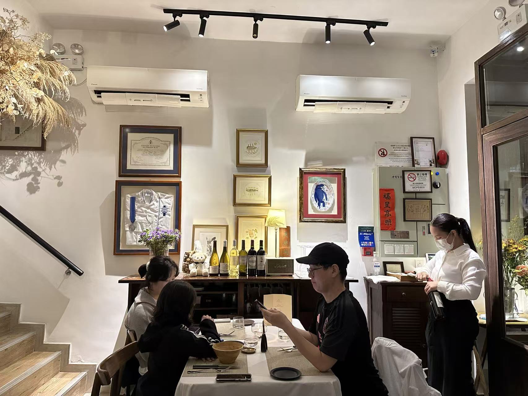 La Sante inside with patrons and waitress